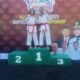Febrina Wulan juara 1 Kata Perorangan ( kiri ) dan Randi Agis juara 1 Komite ( kanan ), mengangkat Medali emas yang diperolehnya