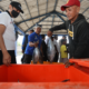 Plt. Bupati Banyuwangi, Sugirah, membuka Banyuwangi Fish Market Festival. Terlihat berbagai produk olahan ikan dan ikan segar dipajang di lapak-lapak.